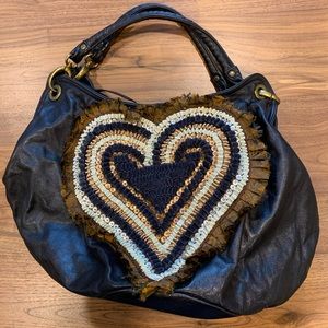 Ipa Nima soft leather ribbon embellished handbag